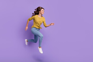 Fototapeta na wymiar Full body profile photo of cheerful pretty lady look empty space run fast isolated on purple color background