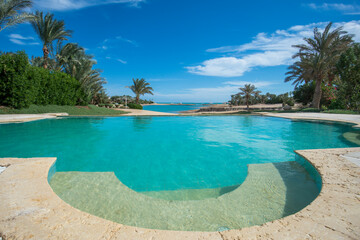 Swimming pool at at luxury tropical holiday villa