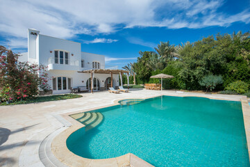 Swimming pool at at luxury tropical holiday villa