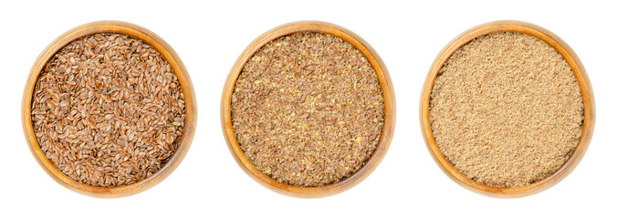Brown flax seeds, in wooden bowls. Whole, crushed and grounded Linum usitatissimum, also common flax or linseed, are rich in omega-3 fatty acids and used as nutritional supplement, or for linseed oil.