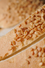 White bread sprinkled with caraway seeds closeup. Shallow depth of field