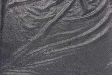 Soft wavy black and silver fabric. Abstract texture background. Fashion and clothes design trends...