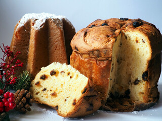 Italian Christmas Panettone cake. Whole, and slices with candied fruit and raisins on white...