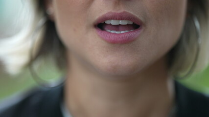 Woman mouth speaking to camera. Girl lips close-up lips talking