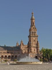Fototapeta na wymiar Tower and fountain on Plaza de Espana, Seville, Spain