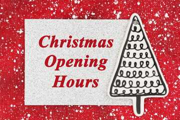 Christmas Opening Hours on silver glitter greeting card with Christmas tree