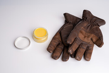 Winter flat lay with cream and gloves 