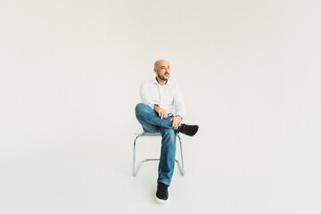 a young man, business, sociable speaker, businessman, says something with gestures. in the studio on a white background.