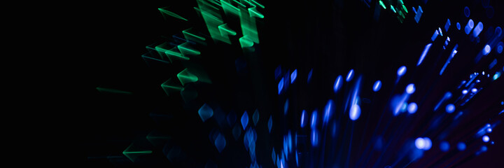 abstract blue on black bokeh background overlay layer. sparks and blowing. festive background. Sparkling magical dust particles.