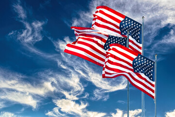 Fototapeta premium American flag against the backdrop of the blue sky