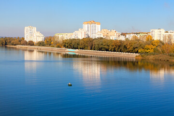 Obraz premium Coastal city scenery . Residential district situated at the river bank 