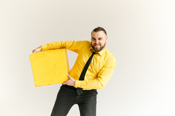 young man, business, sociable speaker, businessman, in a suit with a yellow shirt, in the studio on...