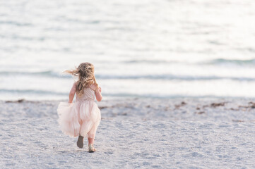 A Young Girl Kid Child Dancing Jumping Walking Running in a Pretty Pink Dress Water Sand Sunset Sun Sun light Beach Horizon Fun Get Outside Childhood Unplugged