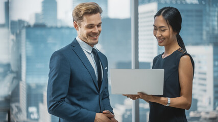 Portrait of Successful Corporate CEO and Investment Manager Talking, Using Laptop Computer while...