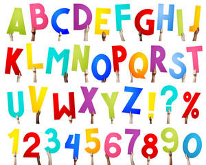 Alphabet - human hands holding colorful letters