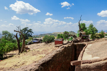 Fototapeta na wymiar Lalibela, Ethiopia - August 20, 2020: Outside view to the Ancient African Churches 