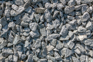 Grey stone rubble, background of many small stones