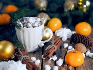 New Year is still life with a retro alarm clock, fir branches, candles and natural decorations on a wooden background. Merry Christmas and Happy New Year.