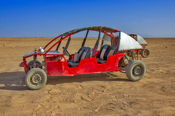 Red dune buggy in Egypt desert