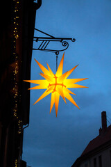 Christmas star at dusk on the background of the evening sky