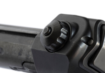 Button at the back of a rifle bolt to reverse the handle