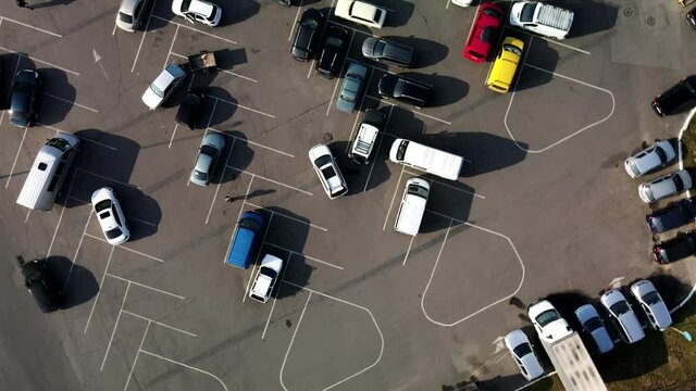 car parking in front of store mall overhead view