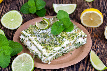 green cake with cream and lime