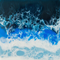 Resin art with bright blue colors. Epoxy effect