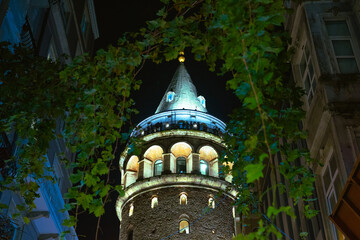 Galata Tower. Galata Tower at night and ivies hanging on the street.