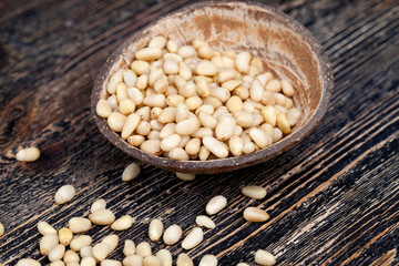 dried cedar nuts on a wooden table