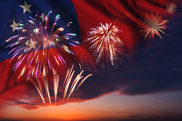 Fireworks in evening sky and flag of Samoa