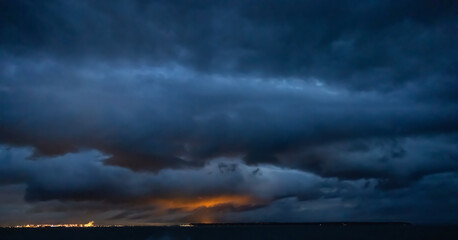 Dark Cloudscape over the West Coast of Pacific Ocean. Taken in British Columbia, Canada. Morning winter sunrise. Sky Nature Background