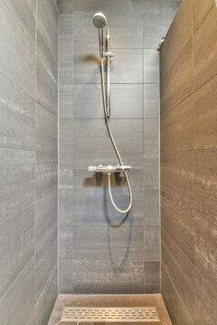 Contemporary shower area with gray tiled walls