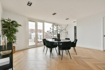 Interior of spacious dining zone with round table
