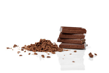 Chopped chocolate isolated on white background.