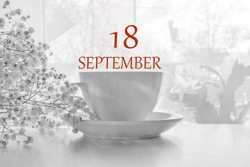calendar date on light background with porcelain white tea pair and white gypsophila with copy...