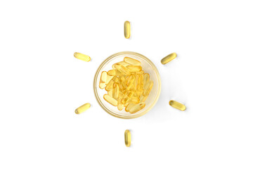 Vitamin D capsules in form of sun isolated on white background.