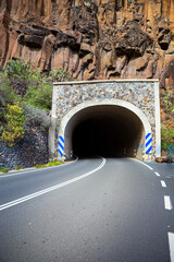 Road tunnel in mountains. The entrance to a tunnel.