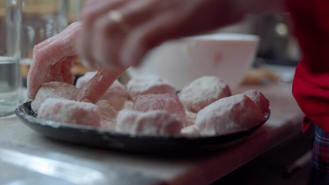 Girl in red longsleeve to cook minced meat cutlets from fresh mea