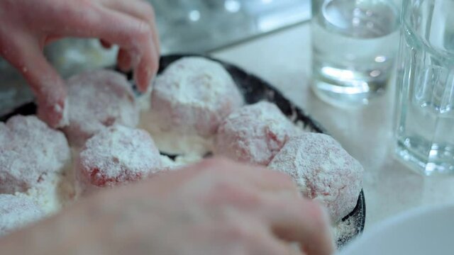 Girl in red longsleeve to cook minced meat cutlets from fresh mea