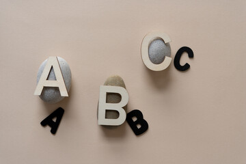 letters and stones on paper