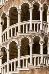 Spiral staircase with round renaissance arches and marble balustrade in Venice