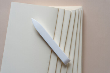 bookbinding - signatures with synthetic bone folder