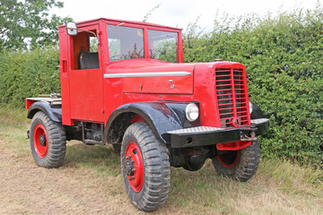 Vintage red truck in a field	