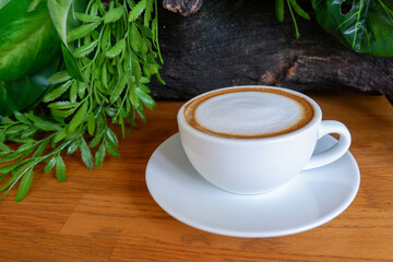 side view coffee in white ceramic cup on wooden floor background,nature wall background