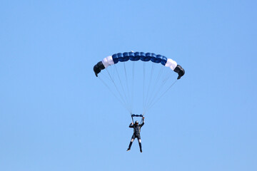 	
Skydiver in a blue sky	