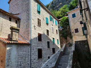 Fototapeta na wymiar Ancient street, historical building in the old town of Kotor, Montenegro, Europe, Adriatic sea and mountains