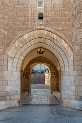 Fototapeta na wymiar Arched entrance to the courtyard of Saint George's Cathedral in Jerusalem Israel 