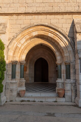 Arched entrance to the courtyard of Saint George's Cathedral in Jerusalem Israel
