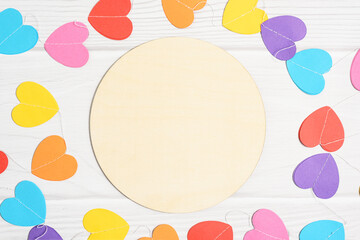 Mockup round sign decorated paper colorful hearts. Valentines day mock up on white woode background, flat lay, top view, copy space.